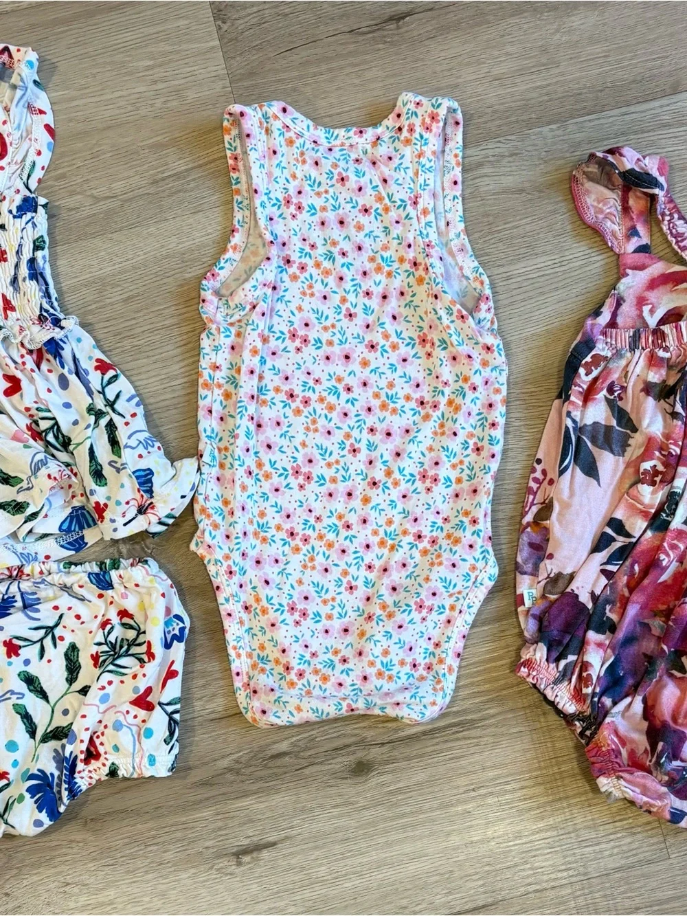 Posh Peanut White Floral Sleeveless Baby One-Piece with Pink & Blue Flowers